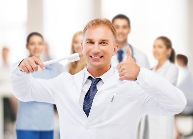 dentium clinica dental - Servicios - healthcare medical stomatology dentist with toothbrush hospital