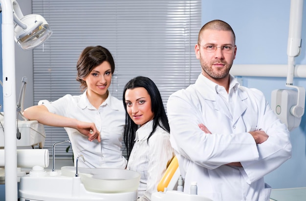 dentium clinica dental -  - portrait confident doctors with patient dental clinic